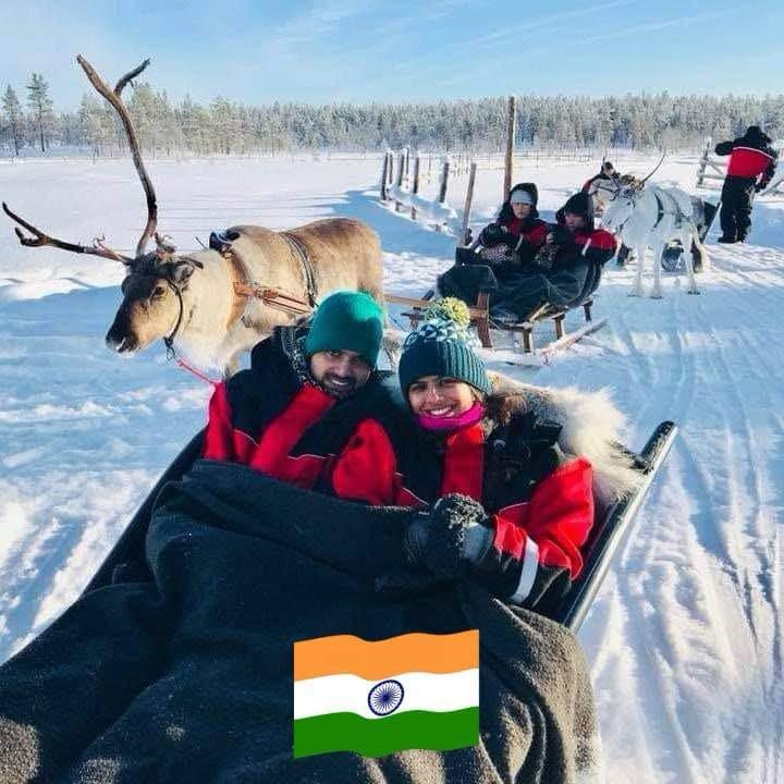 Vandana travellers enjoying a reindeer sleigh ride on a winter holiday